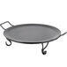 An American Metalcraft wrought iron round griddle with handles on a table.