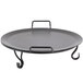 An American Metalcraft wrought iron griddle on a round black metal tray with handles.