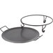 An American Metalcraft round wrought iron griddle with metal holder.