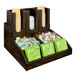 A Cal-Mil dark-stained oak wood coffee condiment organizer on a counter with tea bags.