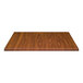 A close-up of a light walnut woodgrain table top.