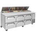 A stainless steel Turbo Air pizza prep table with 6 drawers.