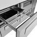 A silver drawer with a drawer in it inside a stainless steel Turbo Air Pizza Prep Table.