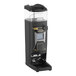 A black Gaggia G10 on-demand espresso grinder on a counter.