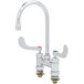 A T&S chrome deck-mount faucet with two handles and 4" centers with a gooseneck spout.