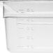 A close up of a clear Choice 1/2 size plastic food pan on a counter.