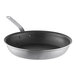 A close-up of a Vollrath Wear-Ever black frying pan with a silver handle.