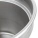 A Vollrath stainless steel inset with a lid.