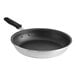 A close-up of a Vollrath Wear-Ever aluminum non-stick frying pan with a black handle.