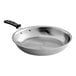 A Vollrath stainless steel frying pan with a black handle.