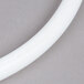 A white plastic tube with a white end used for the top of a Cambro insulated beverage dispenser.