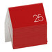 A stack of red and white Cal-Mil table tents with the number 25.