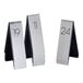 Three Cal-Mil metal rectangular table tents with numbers 1 through 25 on them.
