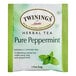 A green and white box of Twinings Pure Peppermint Herbal Tea Bags.