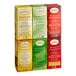 A stack of yellow, red, and green Twinings tea boxes with black text.