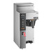 A Fetco CBS-1231 Plus series automatic coffee brewer with a digital display and buttons.