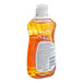 A close up of a bottle of JoySuds orange dishwashing liquid.