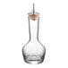 A clear glass Barfly Bitters Bottle with a wooden top.