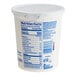 A plastic container of Dannon Non-Fat Vanilla Yogurt with a label.