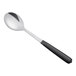 A Vollrath stainless steel spoon with a black Kool-Touch handle.