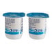 Two Dannon non-fat yogurt containers with blue labels.