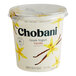 A plastic container of Chobani Non-Fat Vanilla Greek Yogurt with a lid.