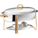 A Choice Deluxe oval chafer with gold accents on a stand.