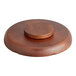 A Town carved wooden pu pu platter with 6 compartments on a round wooden plate.