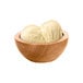 A wooden bowl with two scoops of G.S. Gelato Madagascar Vanilla Gelato.