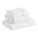 A stack of white Lavex Premium towels.