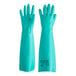 A pair of green Ansell AlphaTec Solvex rubber gloves with the word "glove" on them.