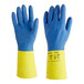 A pair of blue and yellow rubber gloves with a lozenge grip.