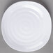 A white Carlisle square melamine plate with a spiral design on it.