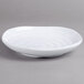 A white Carlisle square melamine plate with a swirl pattern.