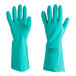 A pair of green Ansell AlphaTec rubber gloves with raised diamond grip.