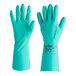 A pair of green Ansell AlphaTec Solvex nitrile gloves with a label.