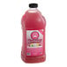 A bottle of Lotus Plant Energy Skinny Pink Lemonade concentrate with a pink label and lid.
