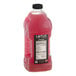 A bottle of Lotus Plant Energy Skinny Pink Lemonade concentrate with pink liquid inside.