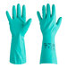 A pair of green Ansell AlphaTec Solvex nitrile gloves with a cotton flock lining.