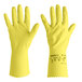 A pair of yellow Ansell AlphaTec natural latex rubber gloves with fish scale grip.