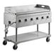 A Backyard Pro stainless steel liquid propane outdoor grill with a griddle on wheels.