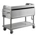 A Backyard Pro stainless steel barbecue cart on wheels.