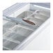 An Avantco gelato dipping cabinet with a curved glass sneeze guard and pans.