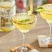Two glasses of Agalima Organic Spicy Jalapeno Margarita Mix with lime and salt on top.