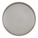 A close-up of a white Cal-Mil melamine plate with a raised rim and a white circle.