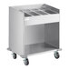 A stainless steel ServIt flatware cart with eight pans.