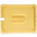 A yellow plastic lid with a handle and white text.