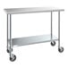 A Steelton stainless steel work table with black wheels.