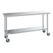 A long rectangular stainless steel Steelton work table with wheels.