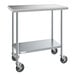 A Steelton stainless steel work table with undershelf and casters.